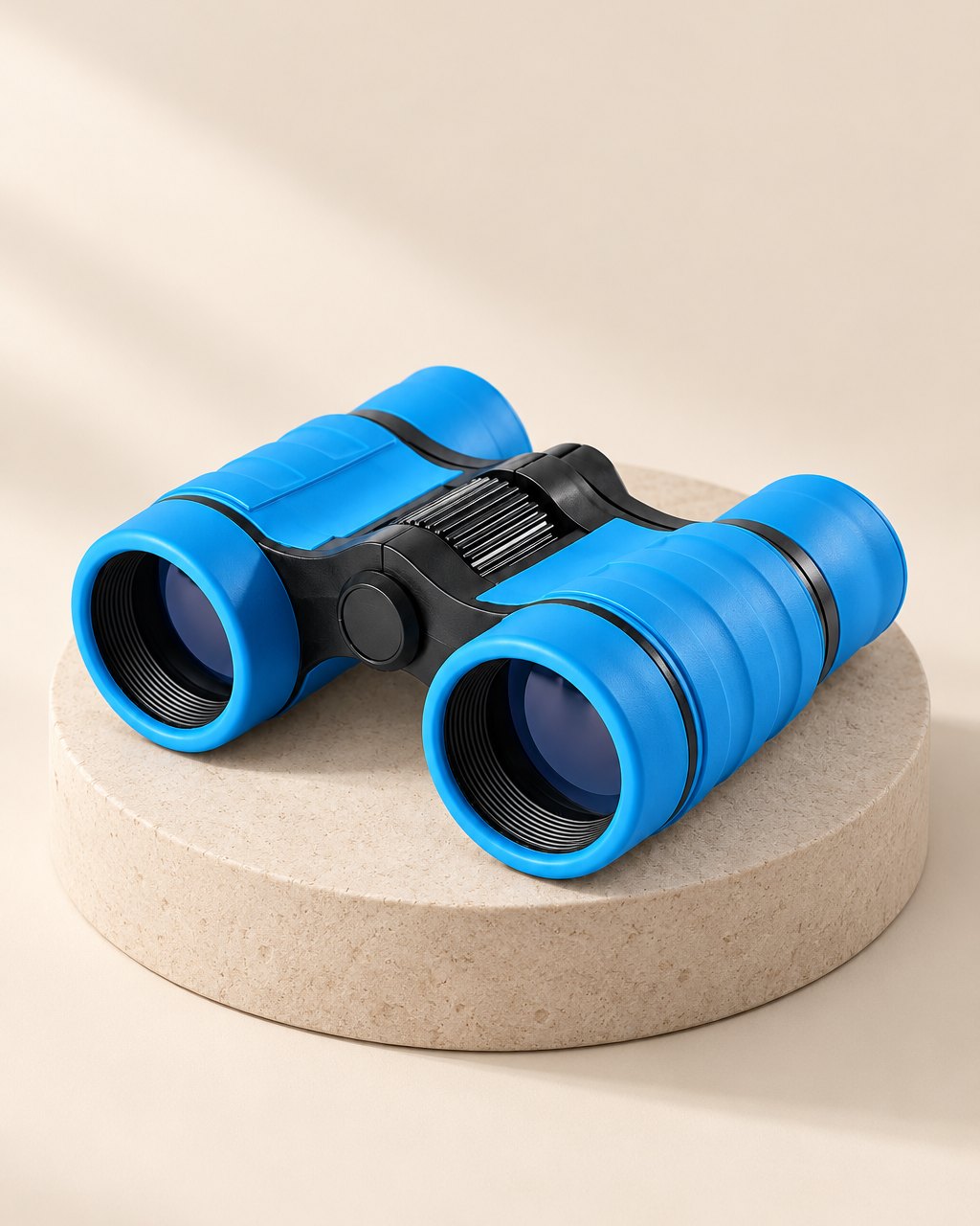 Bright blue compact kids' binoculars with black rubbery grips