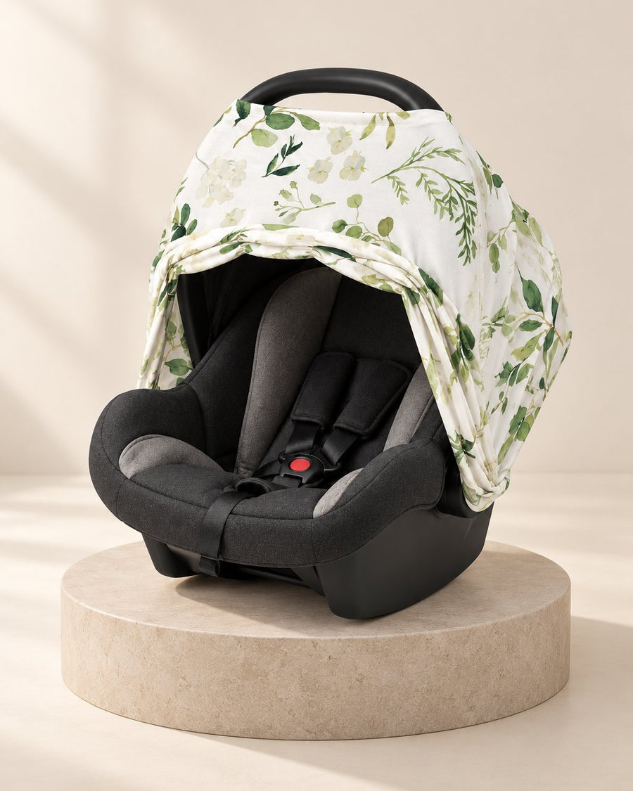Infant car seat with the stretch cover over the canopy and the front folded back open