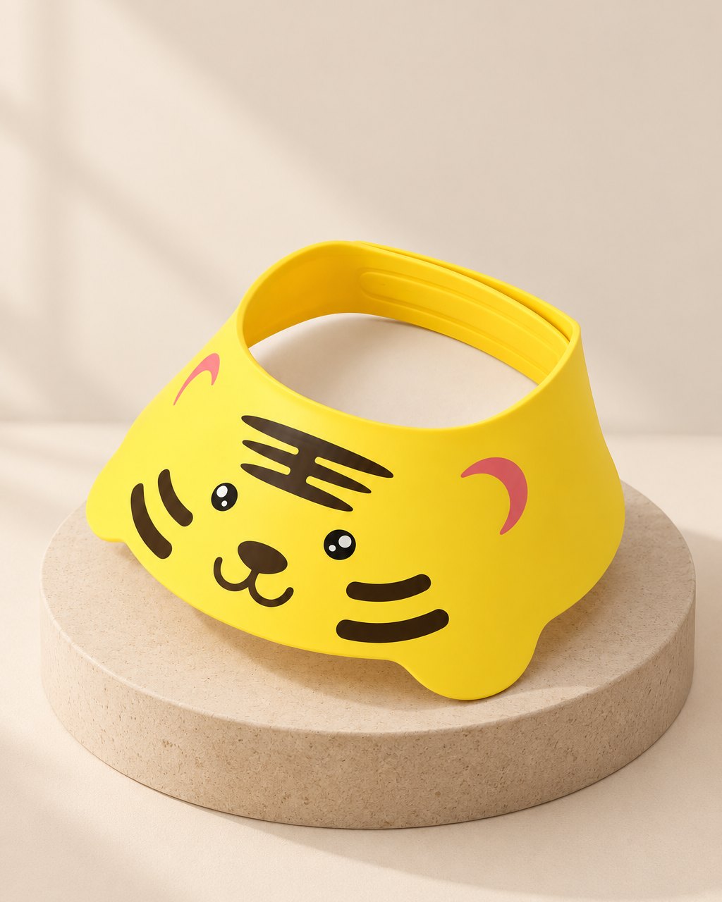Yellow tiger-face shampoo visor with a wide soft brim