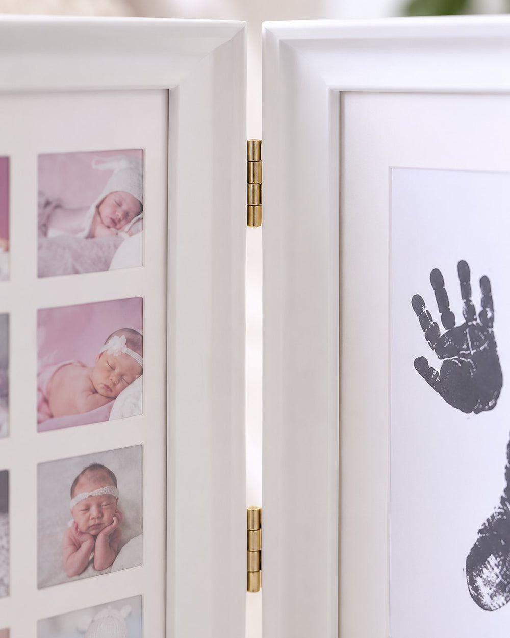 Close-up of the frame's metal hinge and the grid of small monthly photo windows