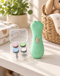 Green nail file and its clear case of grinding heads on a tidy nursery changing-table shelf