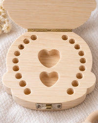 Open tooth box showing the rows of small numbered tooth slots