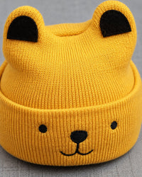 Close-up of the knitted bear ears and stitched bear face