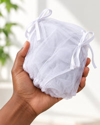 Mesh net folded into a small bundle in one hand