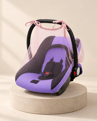 Infant carrier under a mesh net with pink trim