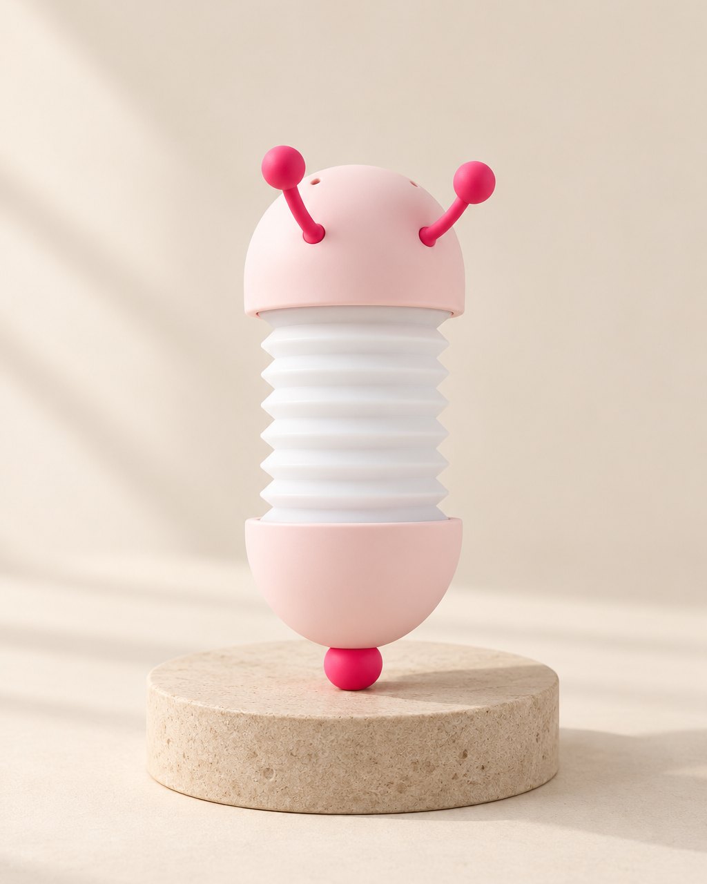 White and pink caterpillar night light with pink antennae and tail ball