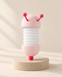 White and pink caterpillar night light with pink antennae and tail ball