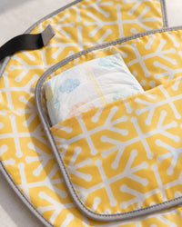 Close-up of the clutch's inside pocket holding a folded diaper