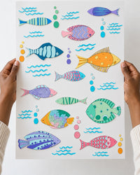 Decal sheet held up in two hands, about 30 by 60 cm