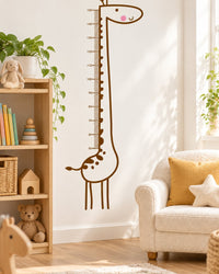 Giraffe height chart beside a bookshelf in a bright kids' bedroom
