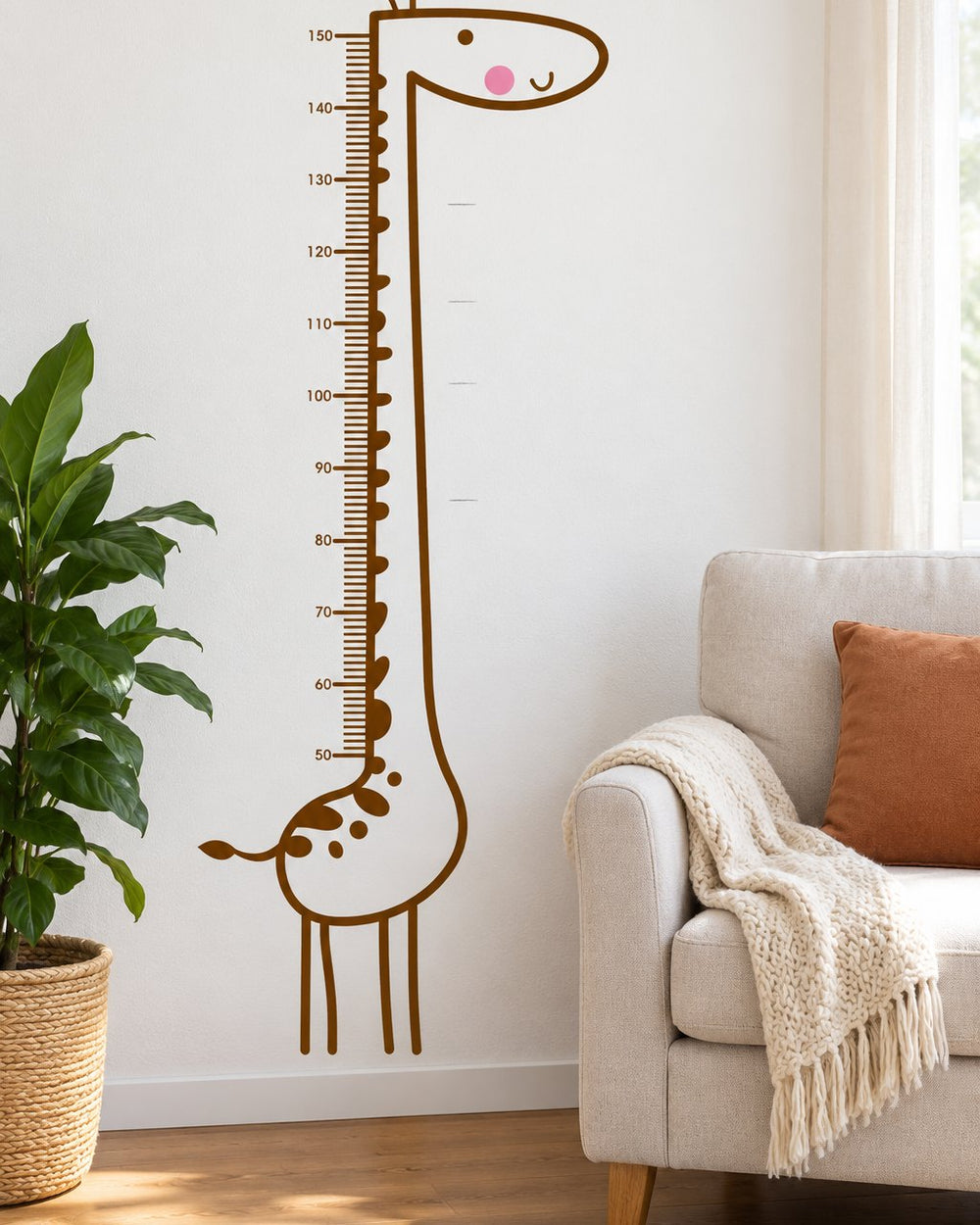 Full giraffe decal on a wall next to a chair, showing it is about 160 cm tall