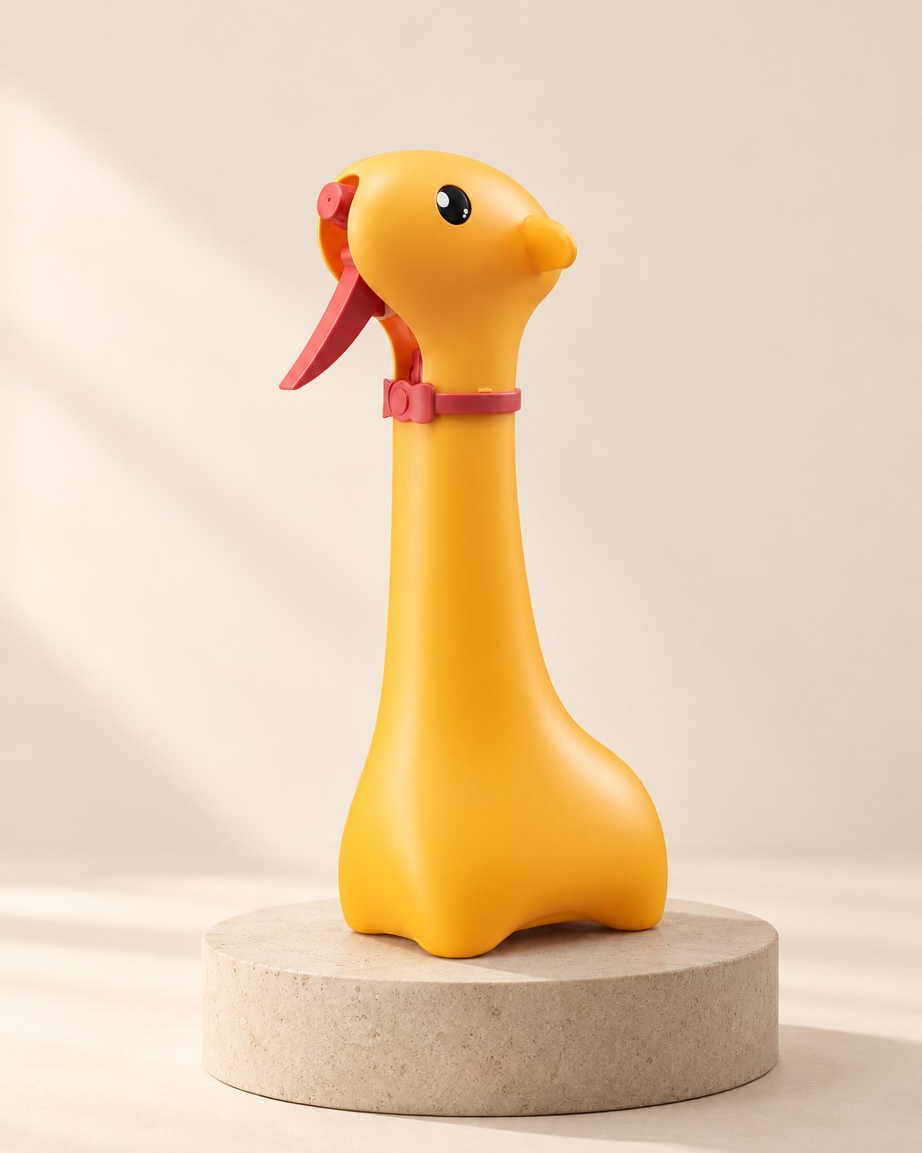 Yellow giraffe-shaped spray bottle with a red trigger in its head