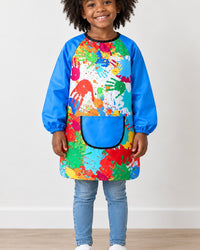 Preschooler wearing the smock, covered from neck to knees