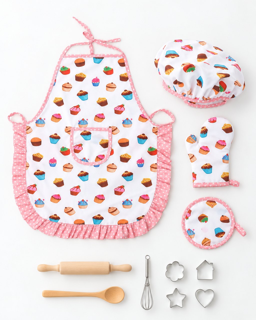 All 11 pieces laid out: apron, cap, mitt, pot holder, rolling pin, spoon, whisk and cutters