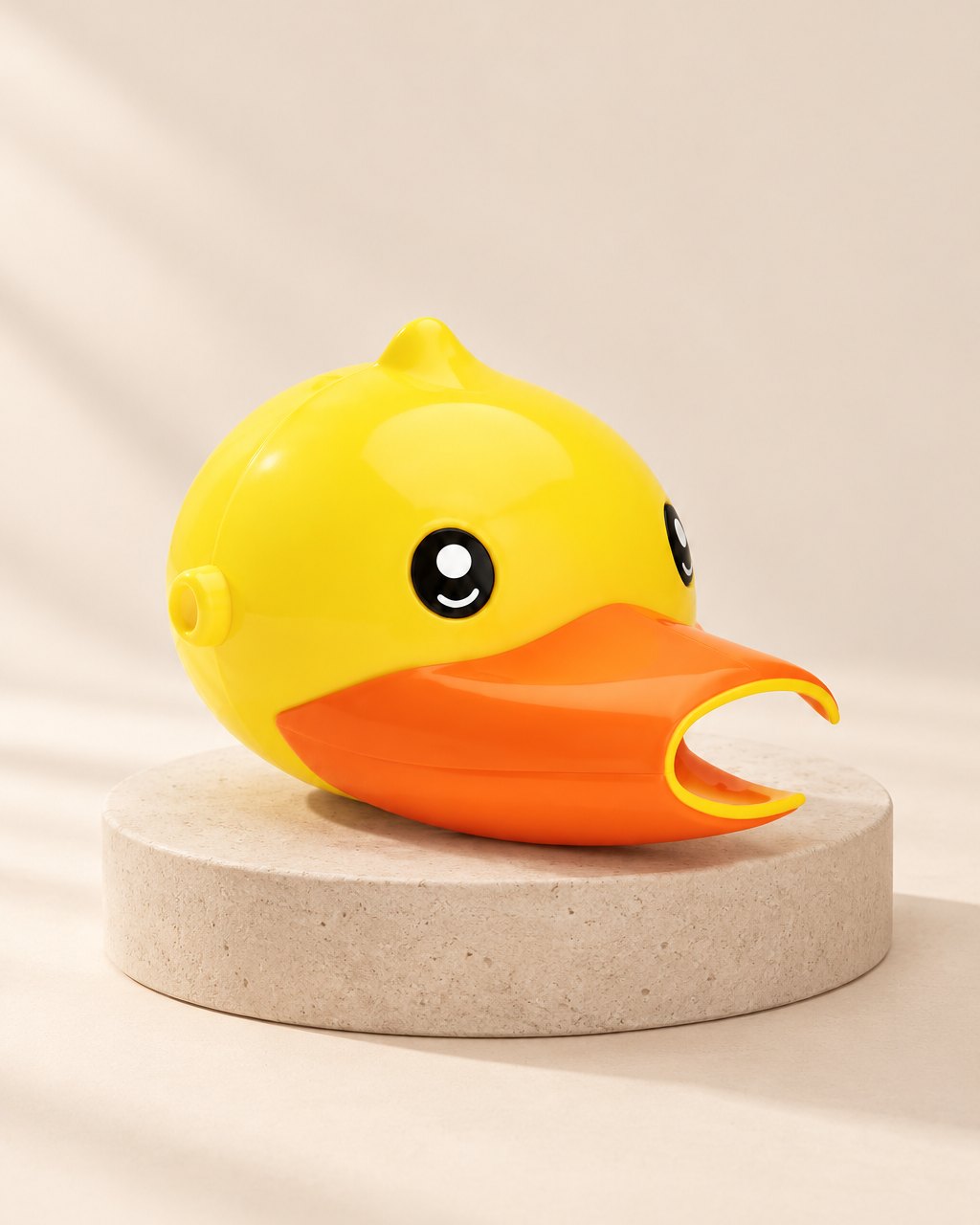 Yellow duck faucet extender with an orange beak