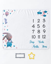 Blanket laid flat with the yellow felt star and grey felt frame placed beside it
