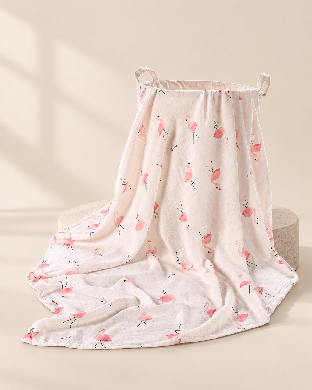 Muslin swaddle blanket with a pink flamingo print