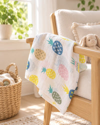 Pineapple muslin draped over a nursing chair beside a window