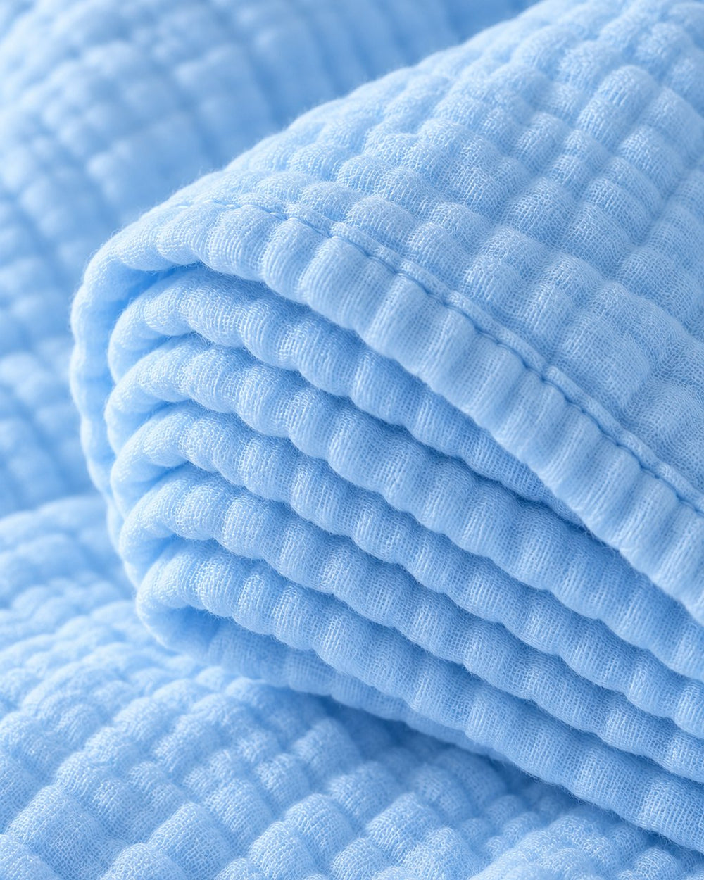 Close-up of the thick crinkled layers at the blanket's edge