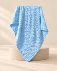 Sky-blue six-layer crinkled muslin blanket, folded