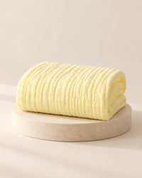 Butter-yellow six-layer muslin blanket, folded
