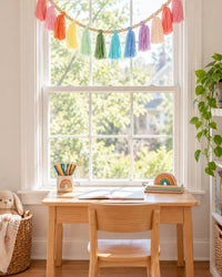 Garland swagged across a window above a child's desk