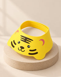 Yellow tiger-face shampoo visor with a wide soft brim