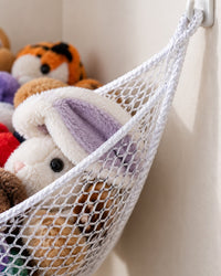 Close-up of the knotted white mesh and a corner loop on a wall hook