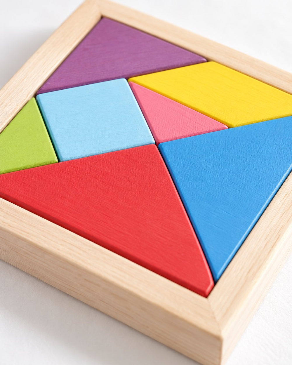 Close-up of the smooth painted pieces and the pine tray edge