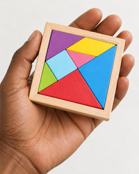Tangram tray held in one adult hand